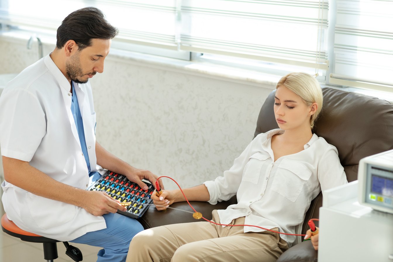 Bioresonance therapist with patient